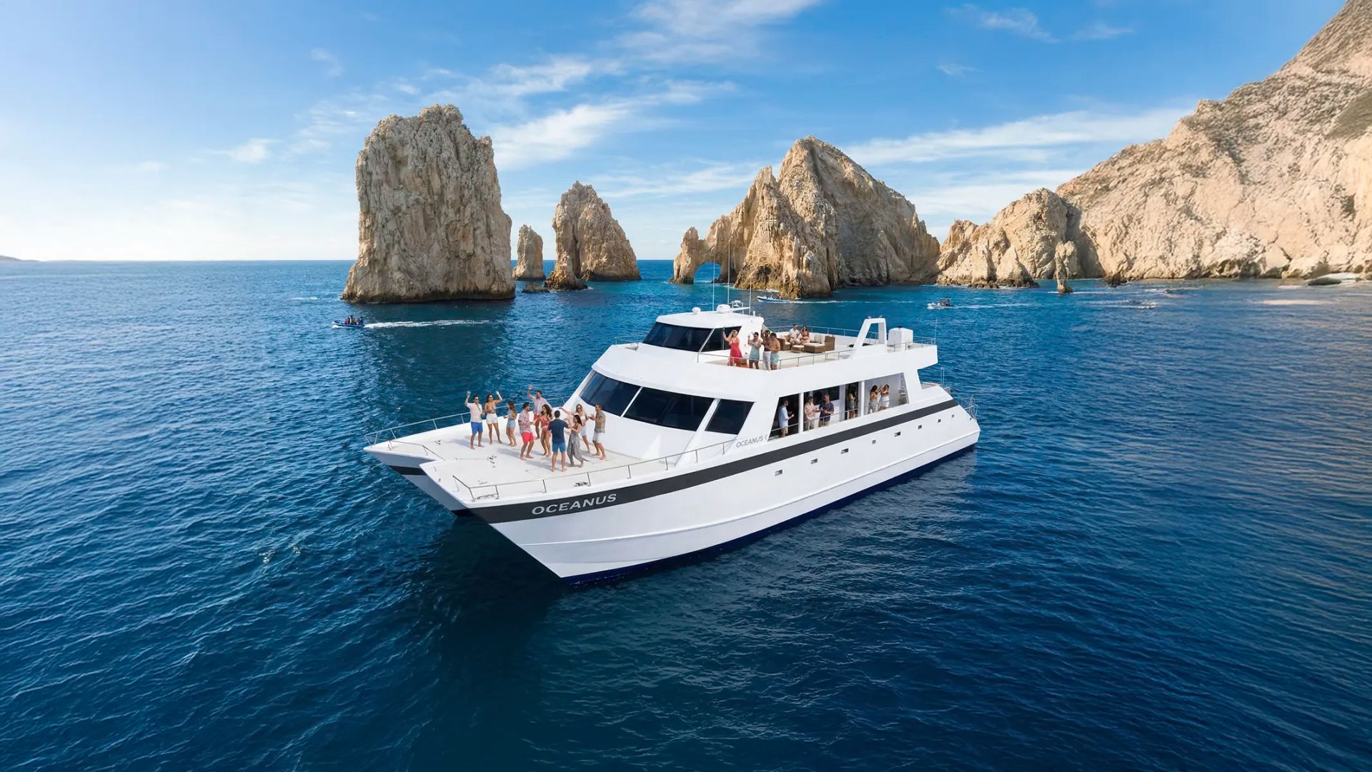 Oceanus snorkel catamaran cruise in Cabo San Lucas sailing near the Arch with ocean views